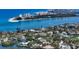 Expansive aerial view showcasing the home's waterfront location and tropical surroundings at 244 Cedar Park Cir, Sarasota, FL 34242