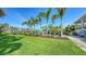Beautifully manicured lawn and landscaped backyard, creating a picturesque and inviting outdoor space at 244 Cedar Park Cir, Sarasota, FL 34242