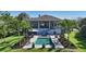 Backyard oasis with pool, spa, lounge chairs, and manicured landscaping, perfect for relaxation and entertaining at 244 Cedar Park Cir, Sarasota, FL 34242