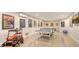 Finished basement includes a ping pong table, toy car, and a collection of art at 244 Cedar Park Cir, Sarasota, FL 34242