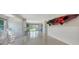 Spacious basement area with an outdoor view and a kayak at 244 Cedar Park Cir, Sarasota, FL 34242