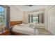 Bedroom featuring a bed and bay window with a view at 244 Cedar Park Cir, Sarasota, FL 34242
