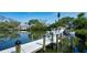 Private boat dock with a boat, providing direct access to the tranquil waters at 244 Cedar Park Cir, Sarasota, FL 34242