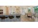 Bright kitchen featuring a center island with bar seating and an adjacent breakfast nook at 244 Cedar Park Cir, Sarasota, FL 34242
