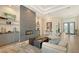 Bright living room featuring a stone fireplace, built-in shelves, and modern decor at 244 Cedar Park Cir, Sarasota, FL 34242