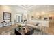 Open-concept living room and kitchen with stylish furnishings and stainless steel appliances at 244 Cedar Park Cir, Sarasota, FL 34242