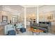 Spacious living area with high ceilings, wood floors, and a view of the kitchen at 244 Cedar Park Cir, Sarasota, FL 34242