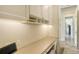 Built-in desk and cabinets provide ample storage in the office space at 244 Cedar Park Cir, Sarasota, FL 34242