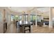 Spacious open floor plan seamlessly integrates the kitchen, dining, and living areas, creating a perfect space for entertaining at 244 Cedar Park Cir, Sarasota, FL 34242