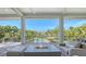 Outdoor patio featuring a fire pit, comfortable seating, and scenic waterfront views at 244 Cedar Park Cir, Sarasota, FL 34242