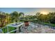 Outdoor patio with waterfront views, outdoor seating and a dining space perfect for entertaining guests and enjoying a glass of wine at 244 Cedar Park Cir, Sarasota, FL 34242