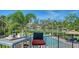 Scenic pool area overlooking the waterfront, complete with seating and lush tropical landscaping at 244 Cedar Park Cir, Sarasota, FL 34242