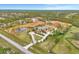 Expansive property featuring an estate home, barn, pond, and fenced pastures for a luxurious lifestyle at 24705 83Rd E Ave, Myakka City, FL 34251