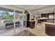 A wine cooler is perfectly positioned next to sliding glass doors to the outdoor space at 24705 83Rd E Ave, Myakka City, FL 34251