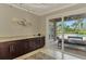 Elegant bar area featuring granite countertops and convenient access to outdoor pool area at 24705 83Rd E Ave, Myakka City, FL 34251