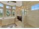 Luxurious bathroom with a soaking tub, walk-in shower, and ample counter space at 24705 83Rd E Ave, Myakka City, FL 34251