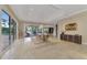 Bright dining area with sliding glass doors leading to outdoor pool, creating a seamless indoor-outdoor dining experience at 24705 83Rd E Ave, Myakka City, FL 34251