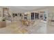 Open-concept dining area near the staircase, offering easy access to the kitchen and backyard patio at 24705 83Rd E Ave, Myakka City, FL 34251