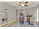 Well-lit exercise room featuring hardwood floors and modern workout equipment at 24705 83Rd E Ave, Myakka City, FL 34251