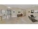 Open foyer showcasing tiled floors, modern furnishings, and seamless transition into other living areas at 24705 83Rd E Ave, Myakka City, FL 34251