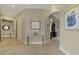 Inviting hallway with decorative tile and neutral paint scheme with view to kitchen at 24705 83Rd E Ave, Myakka City, FL 34251