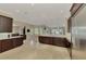 Open kitchen with stainless steel appliances, granite counters, and seamless access to the living spaces at 24705 83Rd E Ave, Myakka City, FL 34251