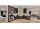 Well-equipped kitchen featuring stainless steel appliances, white subway tile backsplash, and granite countertops at 24705 83Rd E Ave, Myakka City, FL 34251