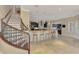 Bright open kitchen with a spiral staircase and eat-in breakfast bar with seating, creating a functional and stylish space at 24705 83Rd E Ave, Myakka City, FL 34251