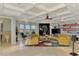 The living room features an eye-catching coffered ceiling, fireplace, and views of the backyard at 24705 83Rd E Ave, Myakka City, FL 34251