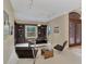 Comfortable seating arrangement with natural light and built-in bookshelves offer a welcoming atmosphere at 24705 83Rd E Ave, Myakka City, FL 34251