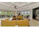 The spacious living room provides seamless transition to the outdoor living and pool area at 24705 83Rd E Ave, Myakka City, FL 34251