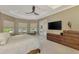 Main bedroom features neutral tones and a tray ceiling with abundant natural light at 24705 83Rd E Ave, Myakka City, FL 34251