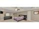 Spacious main bedroom with tray ceilings, ample closet space, and a modern dresser at 24705 83Rd E Ave, Myakka City, FL 34251
