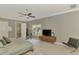 This main bedroom is spacious and well-lit, with neutral walls and modern furnishings, adjacent to an ensuite at 24705 83Rd E Ave, Myakka City, FL 34251