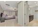 Spacious main bedroom with tray ceiling leading to a bathroom with double sinks and a tiled shower at 24705 83Rd E Ave, Myakka City, FL 34251
