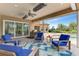 Beautiful covered patio features outdoor furniture and stainless steel grill at 24705 83Rd E Ave, Myakka City, FL 34251