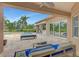 Inviting pool and patio area with outdoor seating and lush landscaping at 24705 83Rd E Ave, Myakka City, FL 34251