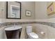 Elegant powder room with vessel sink, mosaic tile backsplash, and stylish fixtures at 24705 83Rd E Ave, Myakka City, FL 34251