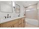 Bright bathroom showcasing double sinks, modern fixtures, and a walk-in shower at 2720 Pinewood Ct, Clearwater, FL 33761