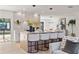 Open-concept kitchen with a large island with barstools, blending seamlessly into the living area at 2720 Pinewood Ct, Clearwater, FL 33761