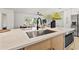 Close up of kitchen island sink, faucet, and butcher block countertop at 2720 Pinewood Ct, Clearwater, FL 33761