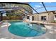 Large screened-in pool with patio and backyard views, ideal for outdoor entertaining at 2720 Pinewood Ct, Clearwater, FL 33761