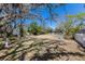 Spacious backyard featuring mature trees with Spanish moss and lush greenery, offering privacy and relaxation at 2723 59Th St, Sarasota, FL 34243