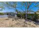 Backyard featuring lush garden beds and a pool with screened enclosure, with plenty of space for outdoor activities at 2723 59Th St, Sarasota, FL 34243