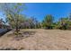 The open backyard area features lush green foliage and landscaping to enjoy at 2723 59Th St, Sarasota, FL 34243