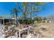 Backyard featuring lush garden beds and a pool with screened enclosure, with plenty of space for outdoor activities at 2723 59Th St, Sarasota, FL 34243