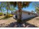 View of the home's exterior and backyard area featuring vibrant foliage around the structure at 2723 59Th St, Sarasota, FL 34243