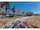 Spacious single-story home with a long driveway and beautiful mature trees at 2723 59Th St, Sarasota, FL 34243