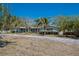 Spacious single-story home with a long driveway and beautiful mature trees at 2723 59Th St, Sarasota, FL 34243