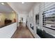 Light-filled hallway featuring tile floors, large windows, and architectural details that add charm to the home at 2723 59Th St, Sarasota, FL 34243